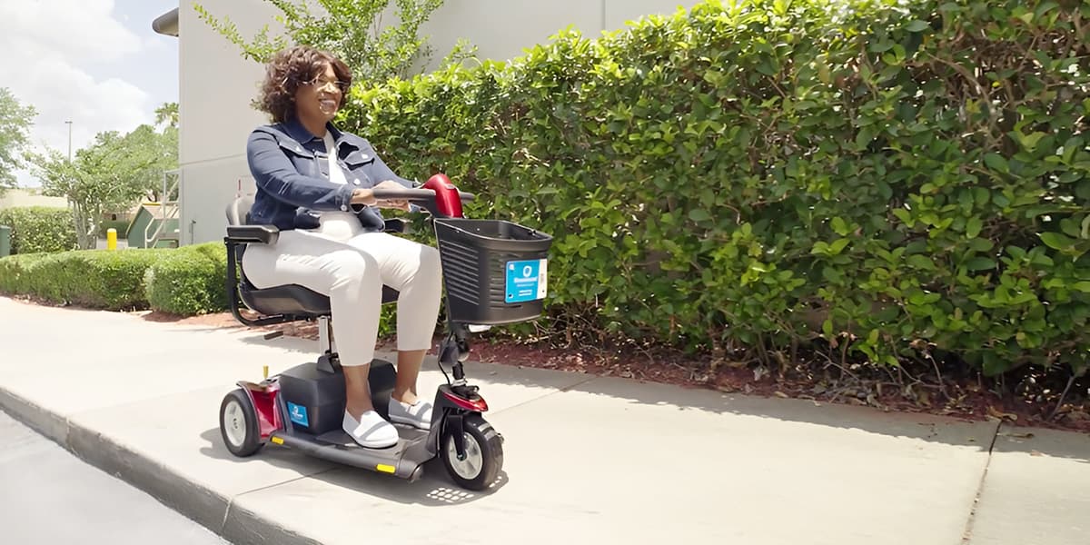 Woman using a Red Scootaround Scooter