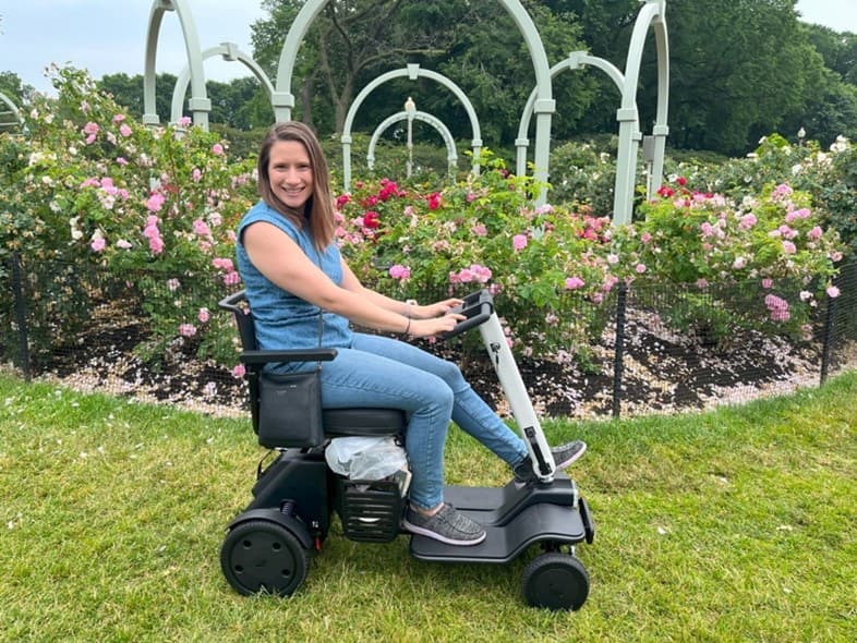 Woman on Scootaround Transportable Scooter Rental